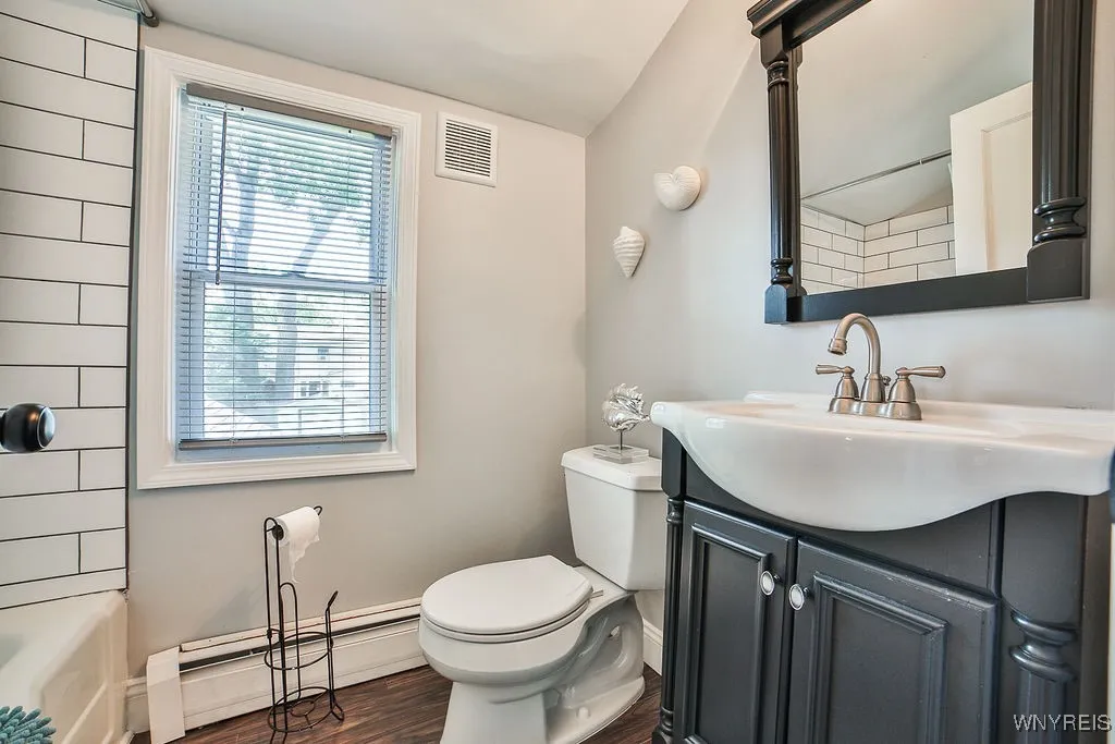 Nicely refreshed full bath.