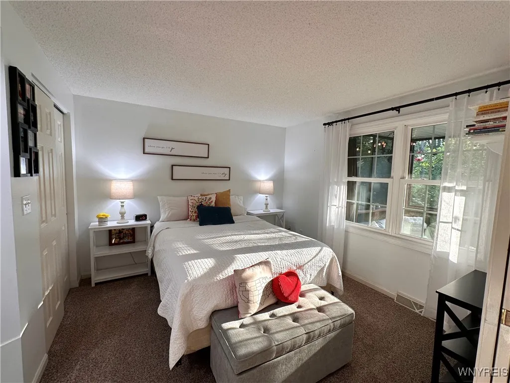 Windows embrace the natural sunlight and spacious double closet