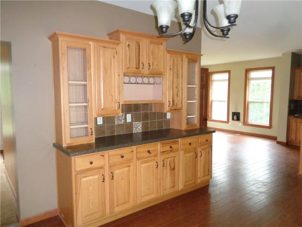 Hutch in Kitchen provides additional storage or a location for your at-home bar.