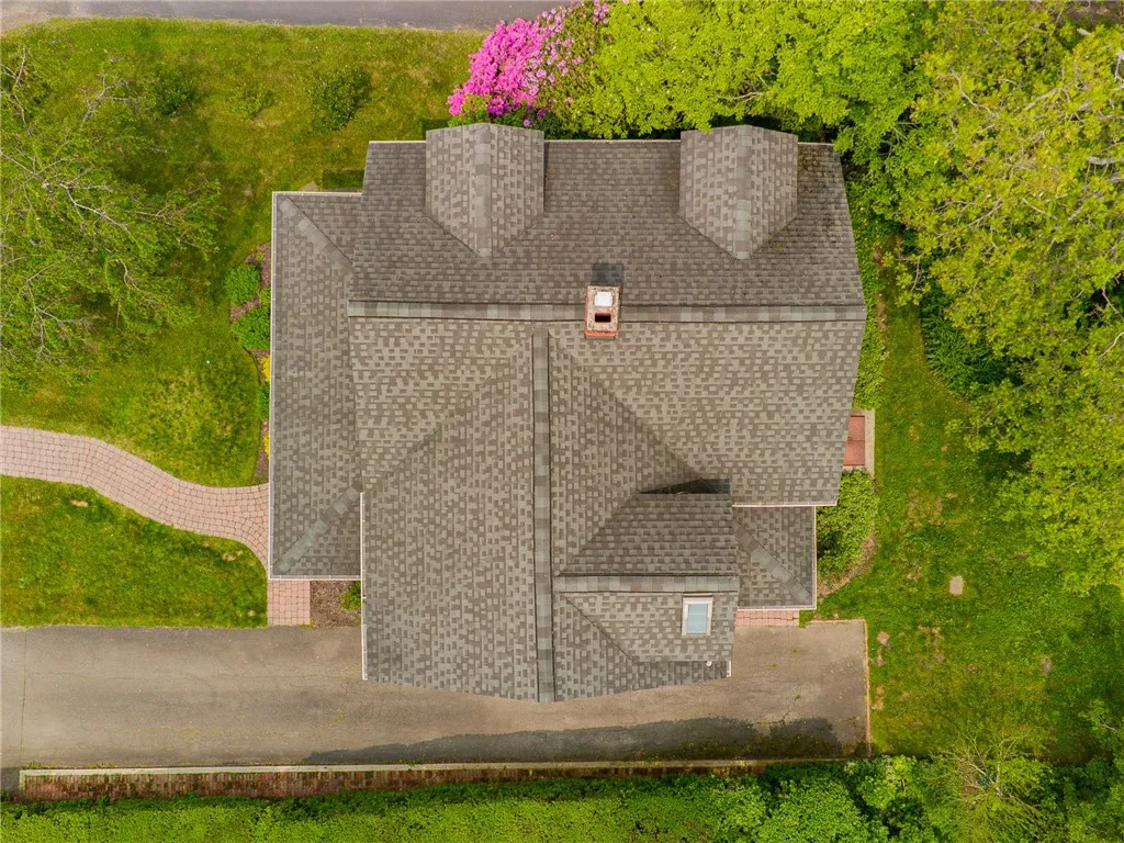 Architectural style roof on this circa 1800s home - this home still holds the charm of yesteryear! Tin lighting fixtures, Dutch door, plank flooring and more!