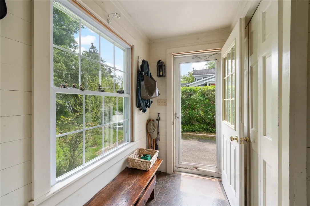 The rear mudroom- plenty of space for all those coats and boots and comfortable bench seating
