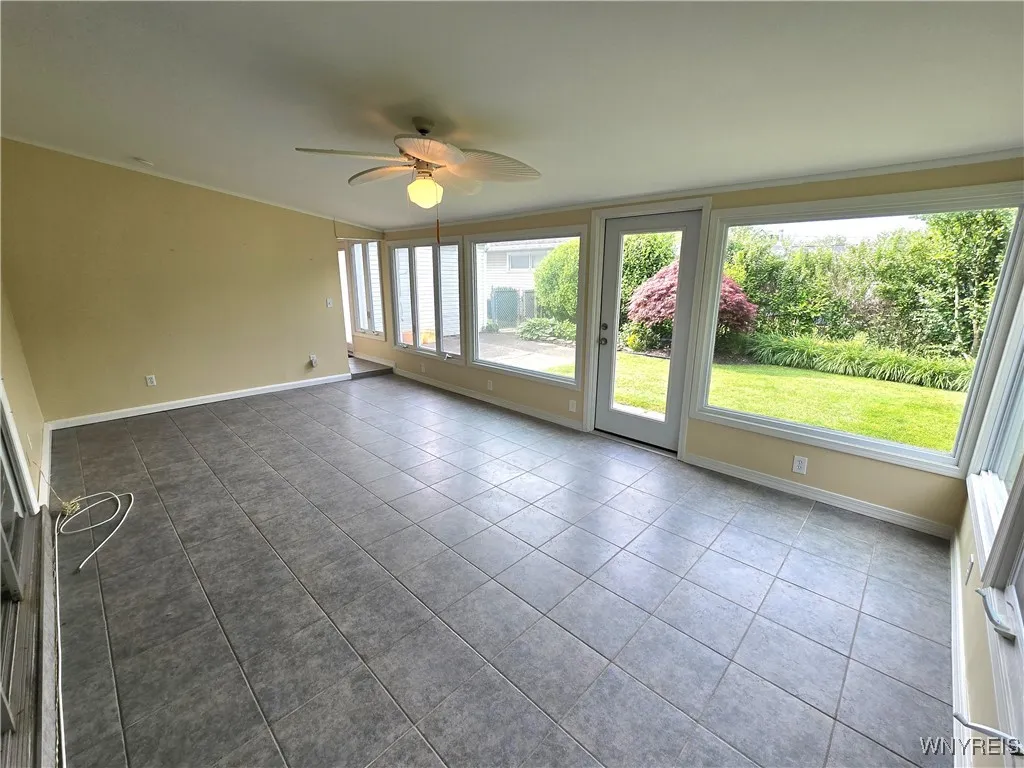 Sunroom with vaulted ceiling