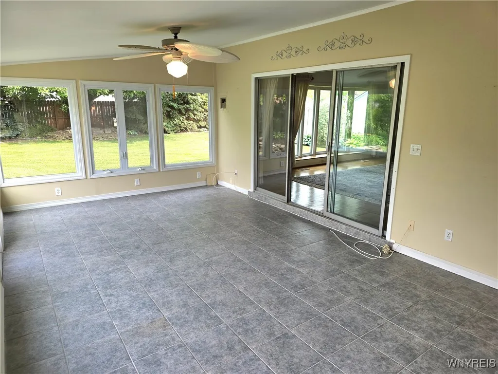 Sunroom with vaulted ceiling
