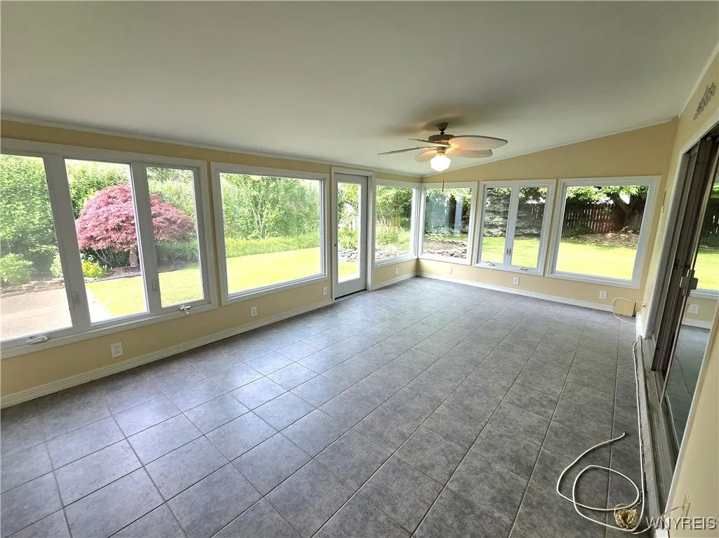 Sunroom with vaulted ceiling