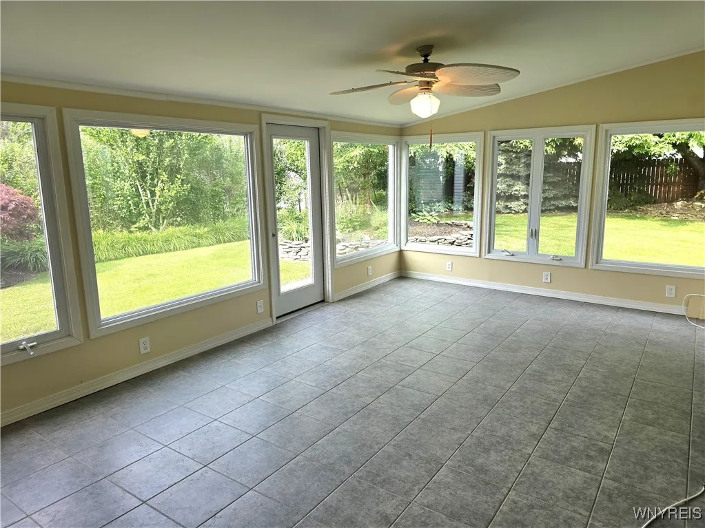Sunroom with vaulted ceiling