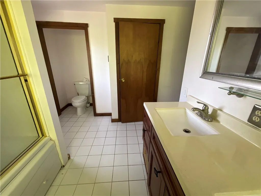 Reverse view of the master bathroom.