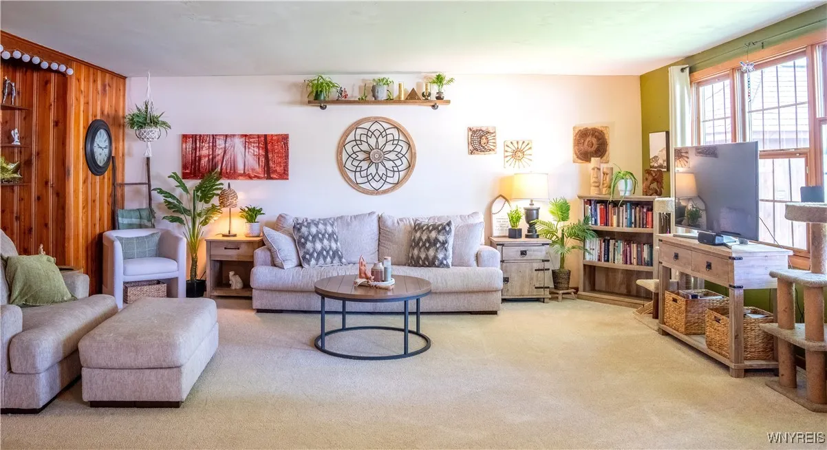 Comfy living room with modern decor and newer carpeting!