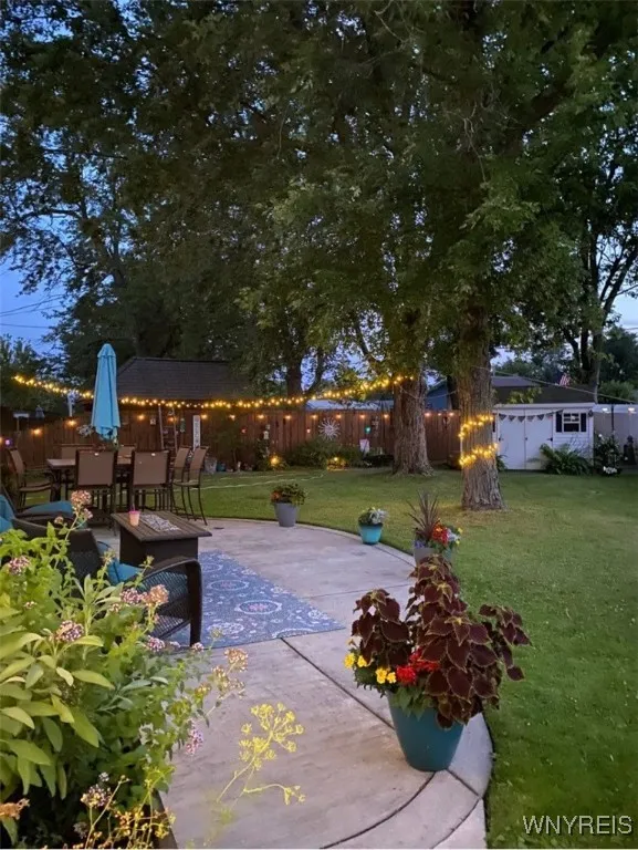 Evening view of the back walkway to the patio.