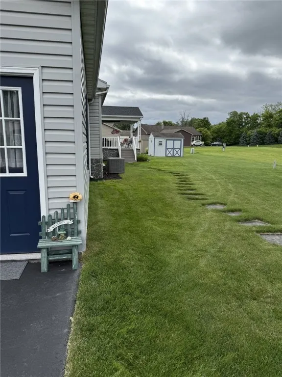 Side Yard- Garage (left), Shed & Porch (background)