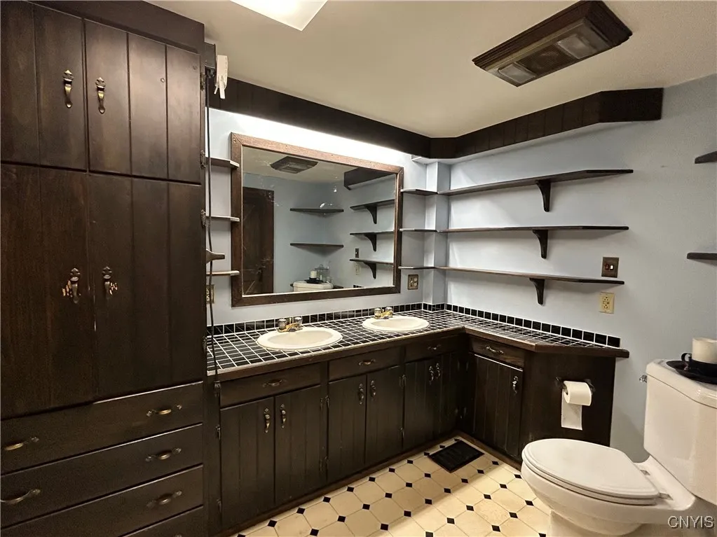 Custom cabinets! His and her sinks!