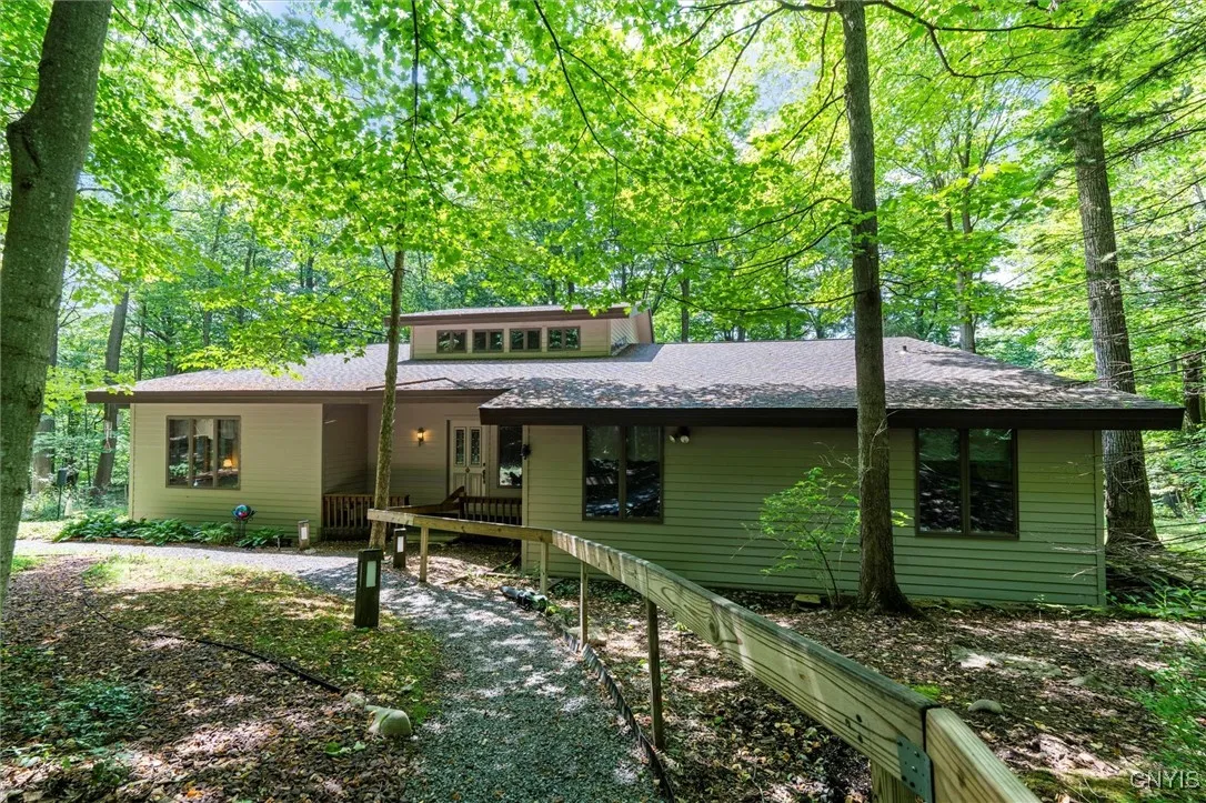 FRONT OF HOME WITH WALKWAY TO HOUSE
