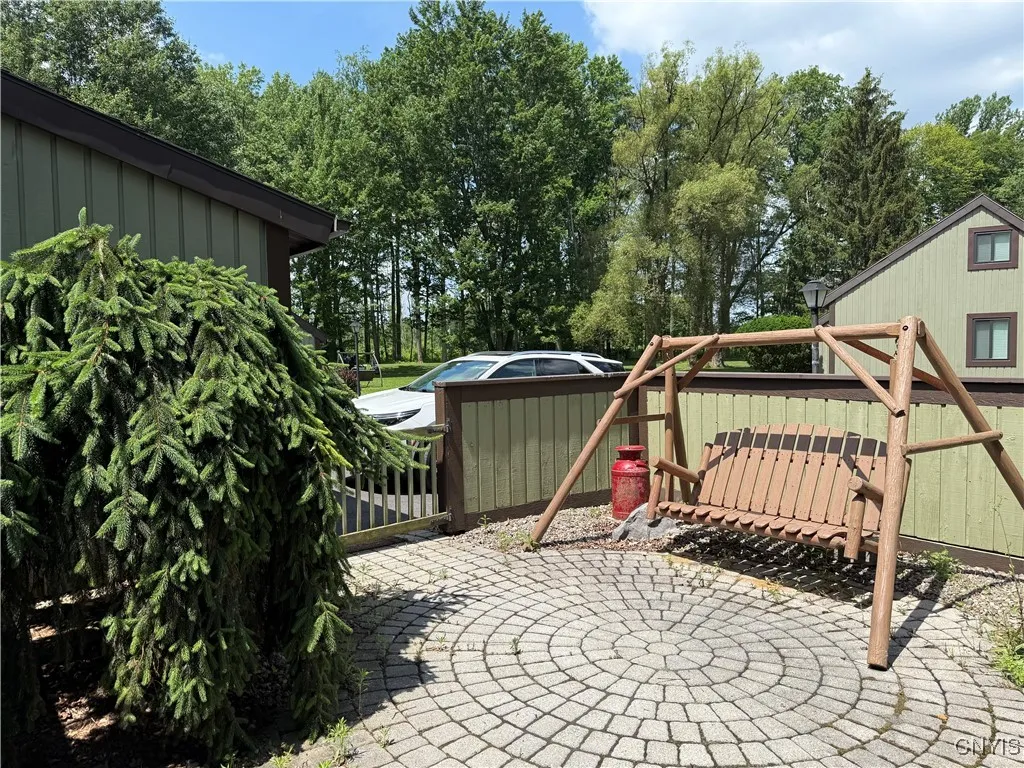 NICE PARTIALLY ENCLOSED PATIO OVERLOOKING THE GOLF COURSE