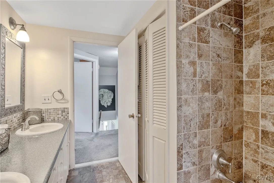 Notice the fabulous tub and shower area, and the large linen closet! You will see also that the bathroom is located right at the top of the stairs.