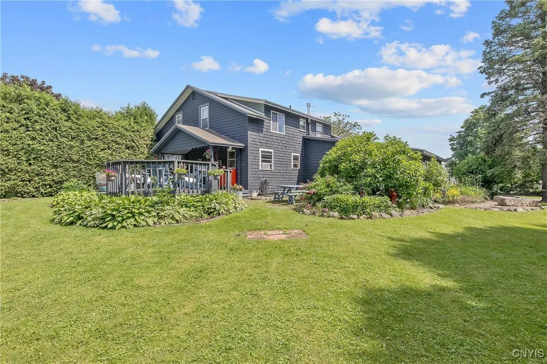 From the back corner of the property, you see the deck and the patio area. Both are perfect for those outdoor gatherings!