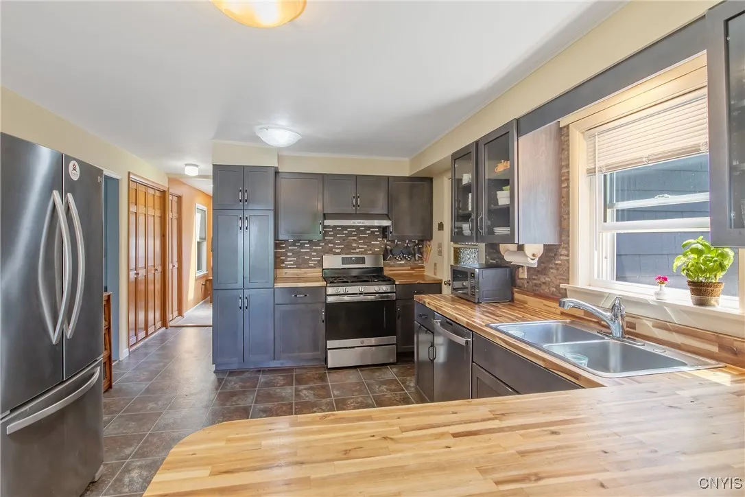This cooking area will delight any chef! The floor to ceiling cupboards hold wonderfully convenient pullout shelves.