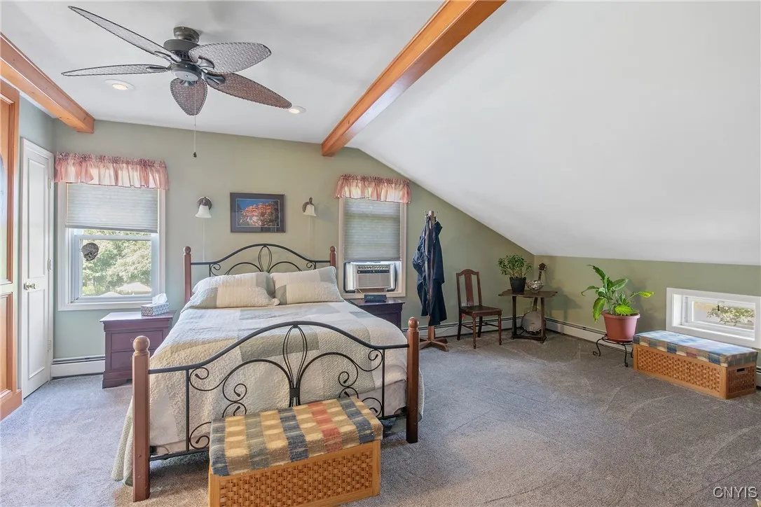 Looking at the primary bedroom from the doorway, you will see all of the extra space around the bed.