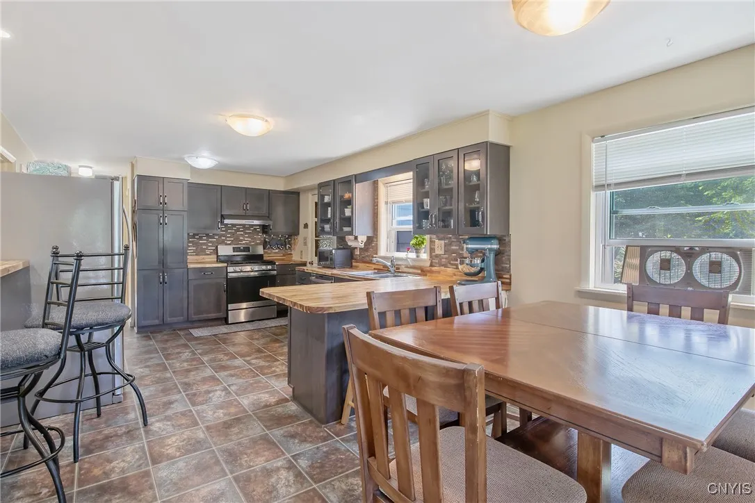 As we enter the kitchen from the living room, we have a nice look at the huge open concept kitchen and eating area.
