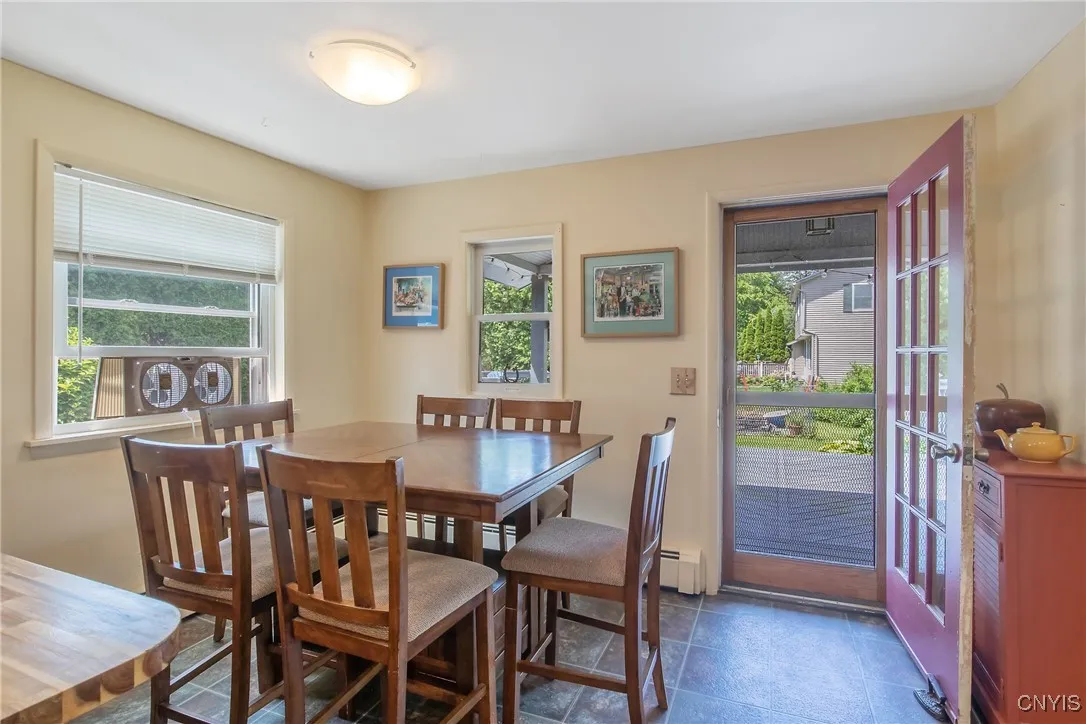 The eat-in space will comfortably accommodate 6 people with more space at the counter. And it is located right next to the door to the fabulous backyard which we will explore later.