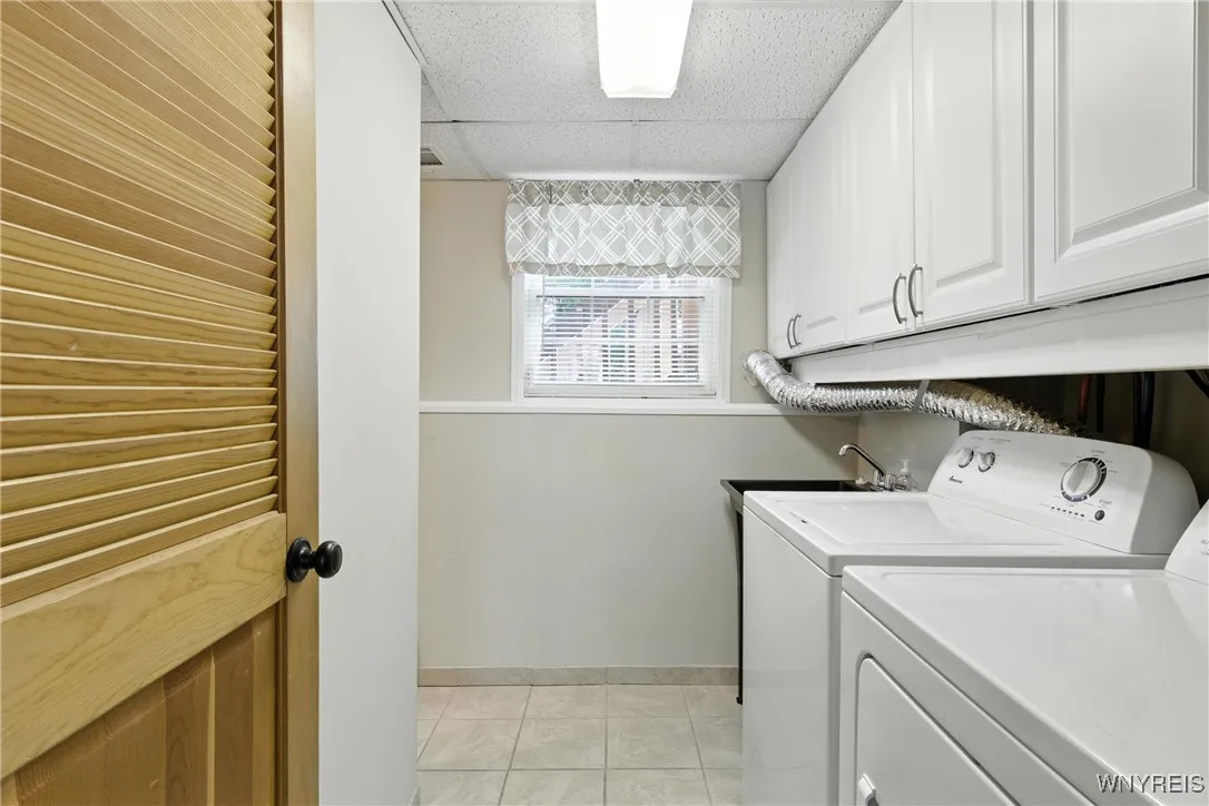 Everyone needs cupboards in the laundry room!  It also has a sink.