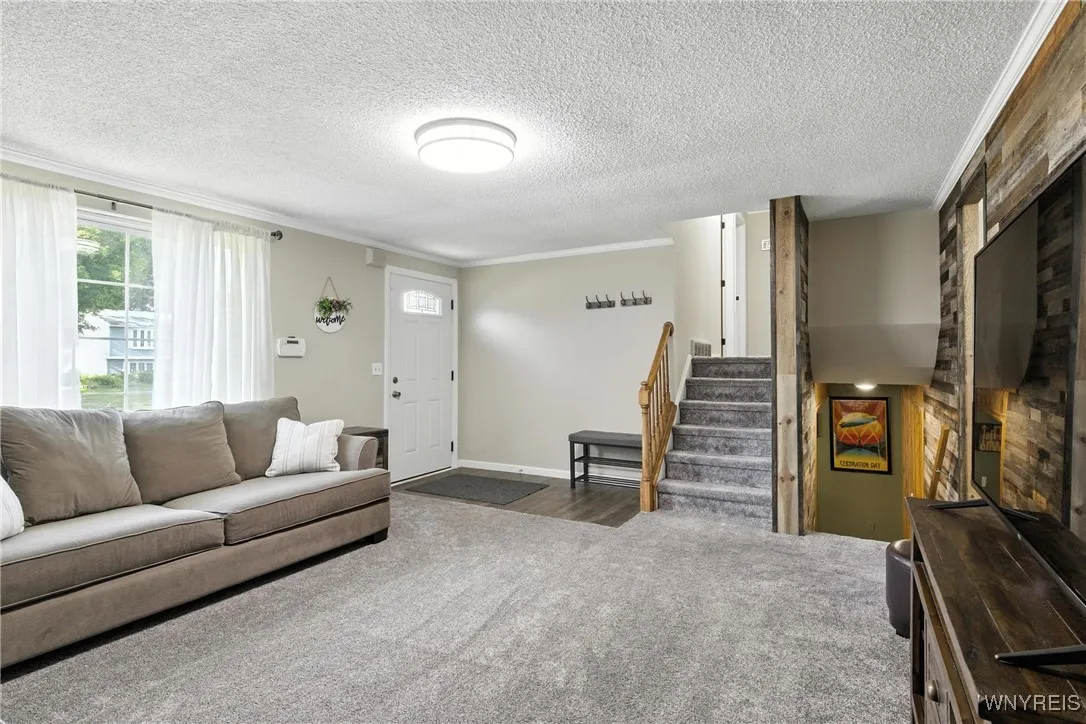 Large picture window for natural light. Laminate flooring in entry.