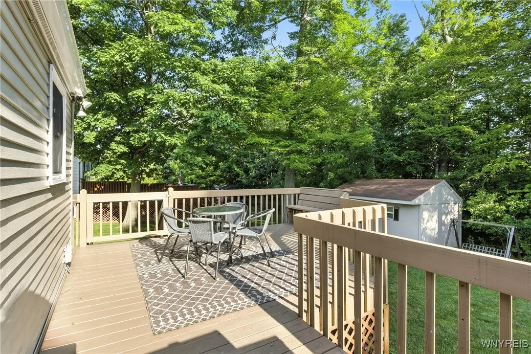 Deck has a great area for a table plus a bench for additional seating.  Separate grill area.