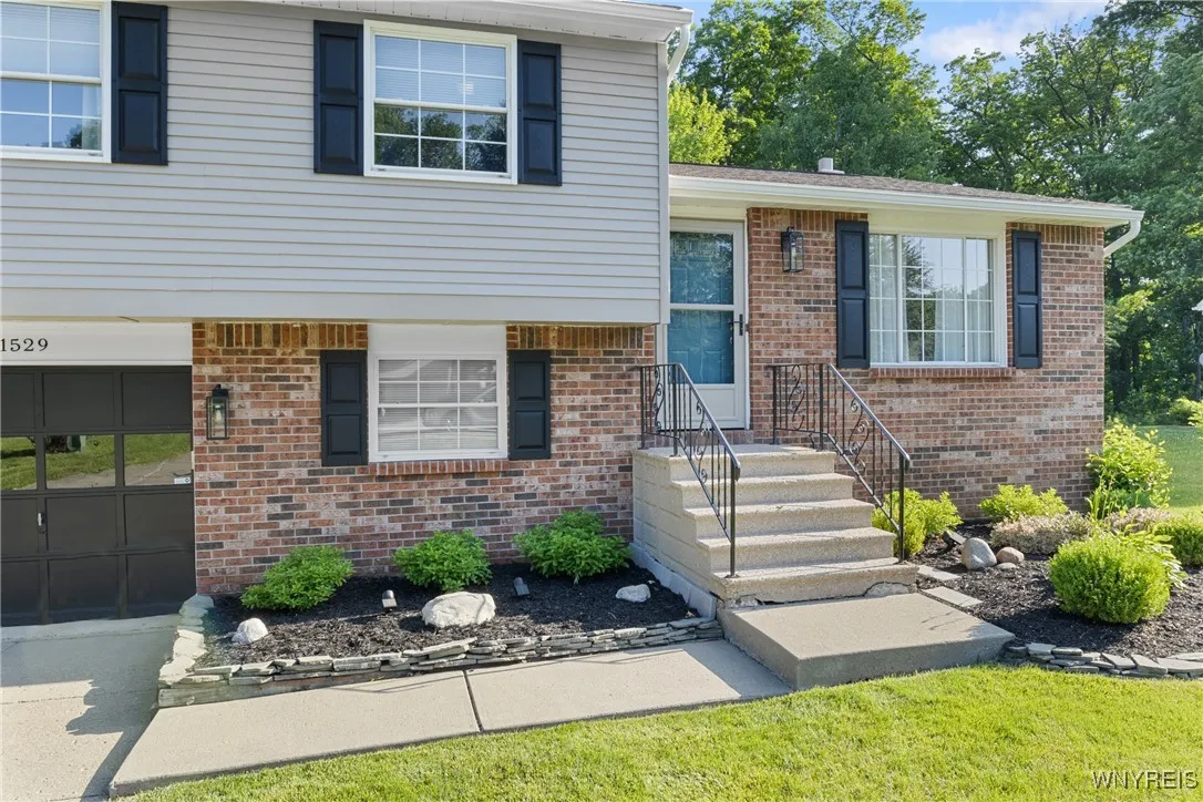 The house looks fantastic with it\'s freshly painted exterior, new shutters, lighting and landscaping.
