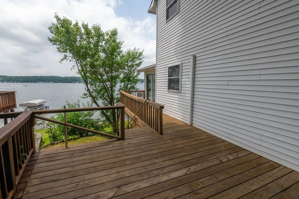 Side deck of the enclosed 4 season porch, stairs leading down to yard