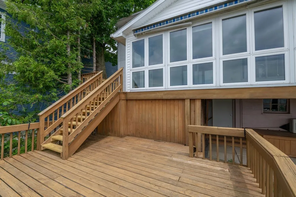 Main deck with stairs down from 4 season enclosed porch
