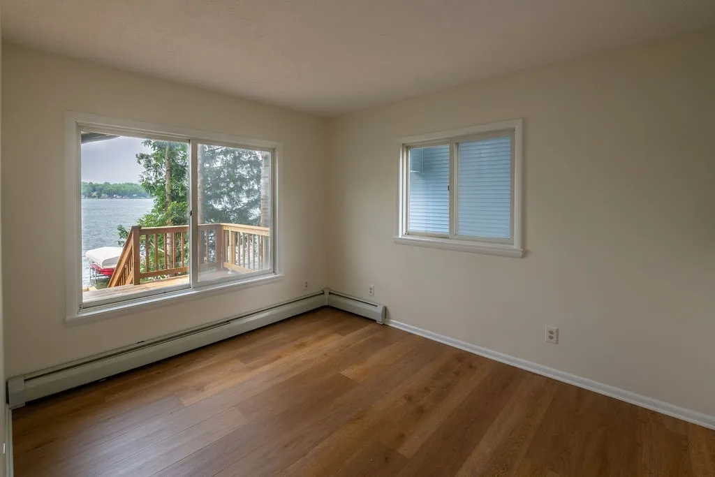Bedroom 1 on main floor with lake views