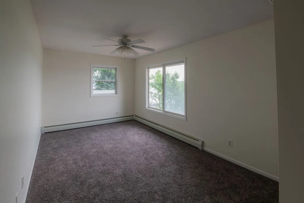 Bedroom 2 upstairs with lake views, there is a 2nd Fujitsu mini split A/C unit on the wall to the right so you have different zones (up and down), brand new carpet