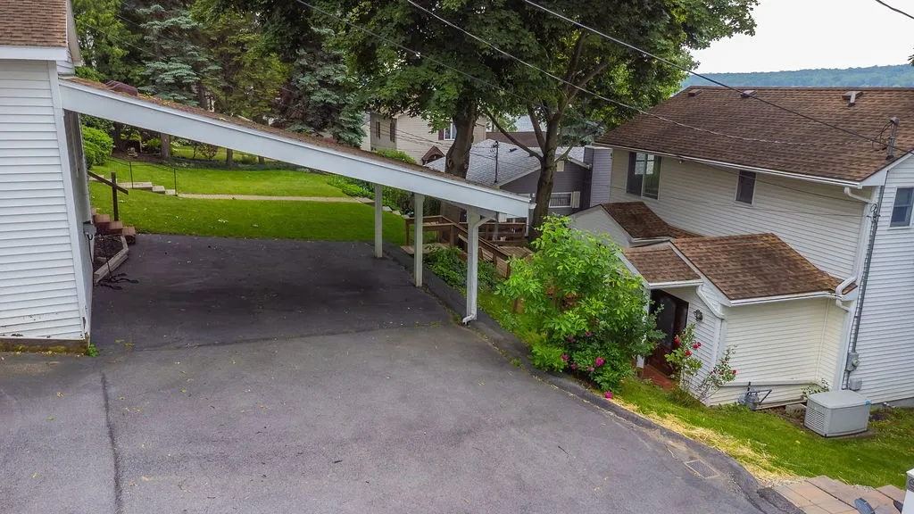 Carport easily first 2 cars, provides plenty of cover from sun and rain