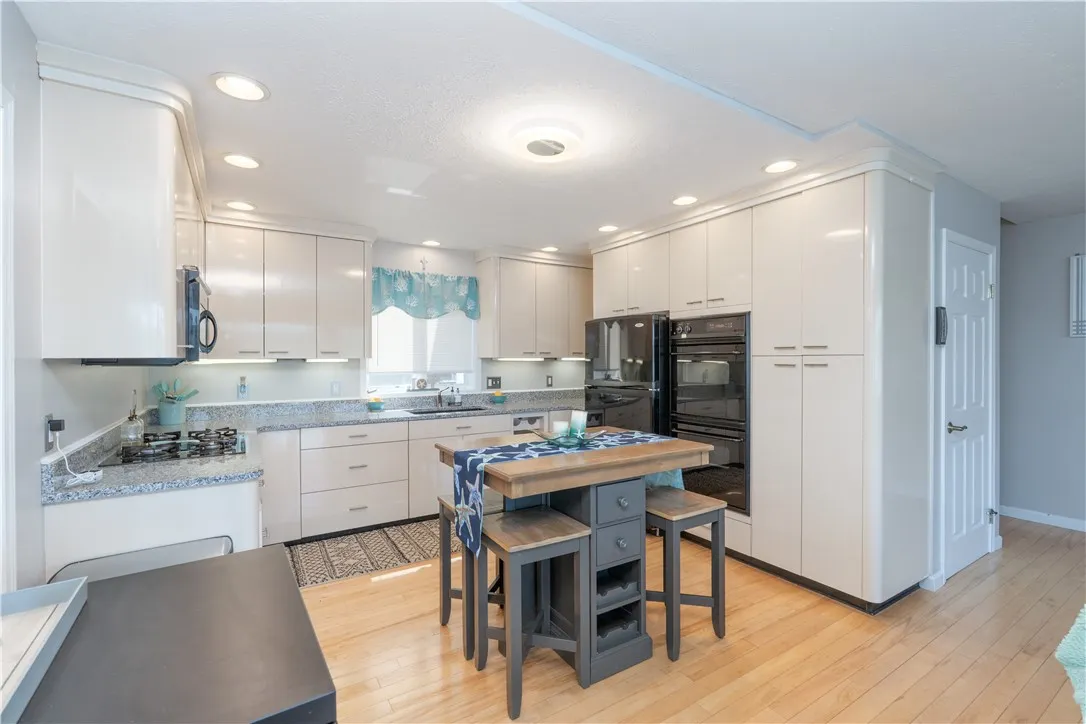 Beautiful kitchen with new granite countertops and double oven.