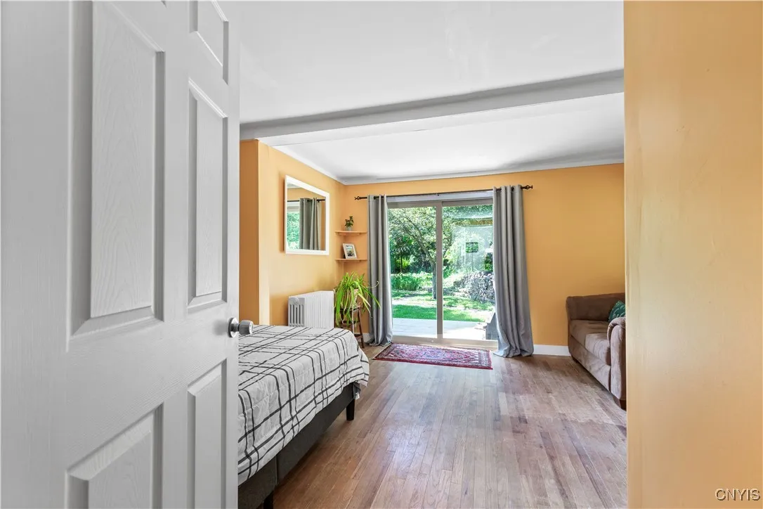 The first-floor bedroom has a sliding glass door that lets in so much natural light and nature views!
