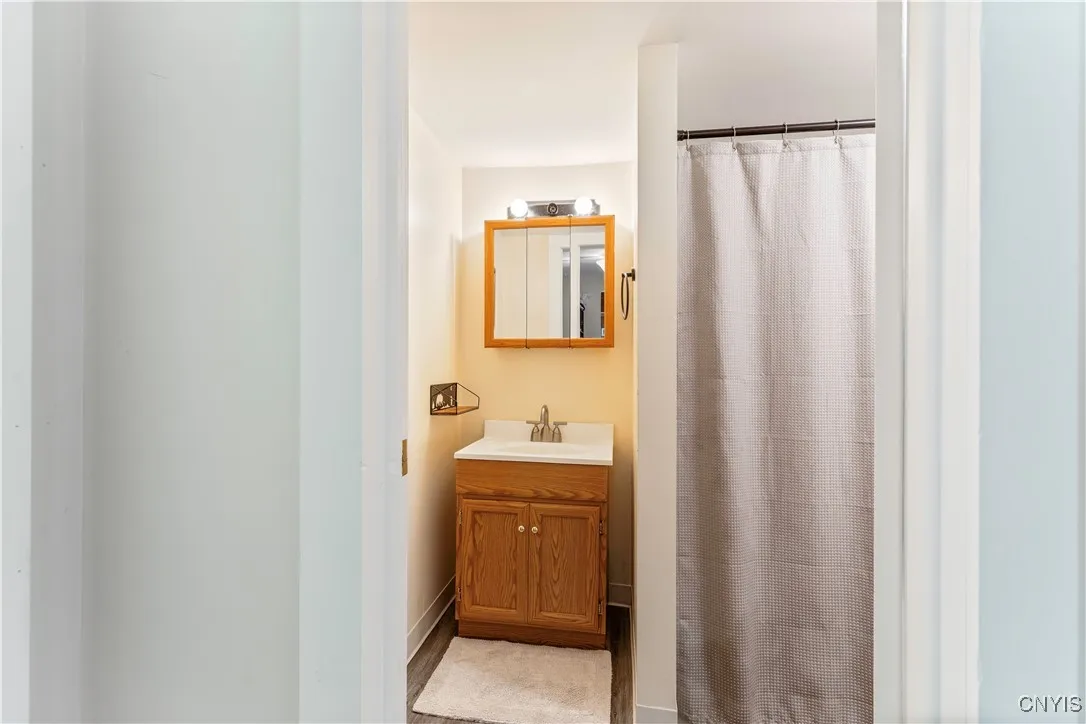 Peeking into the full bathroom on the first floor. To the left of the photo is the first floor bedroom. This bathroom has a tub.