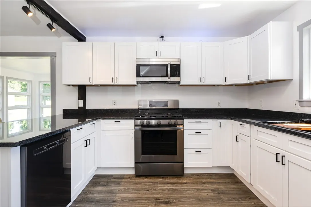 All New , never been used gas stove, dishwasher, refrigerator, microwave, state of the art sink, all new lighting, and of course brand new flooring and cabinets, hardware and of course GRANITE Countertops!!