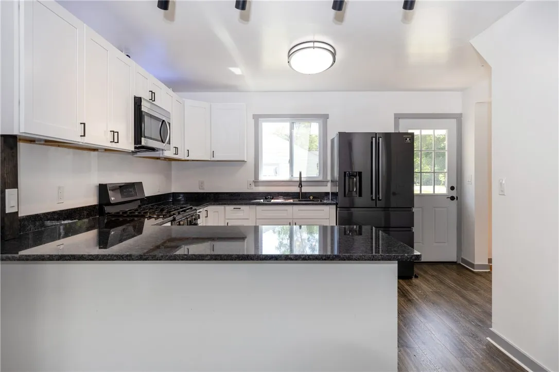 That's the door that goes out to the Brand New Deck on the drive side of the house. Easy access with all those groceries!