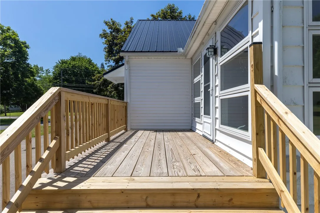 Brand new Deck off of the side of the house to the entrance into the beautiful Sun room/family room!