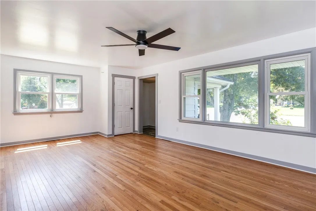 Here i the main front room with all original hardwood floors and a large coat closet.