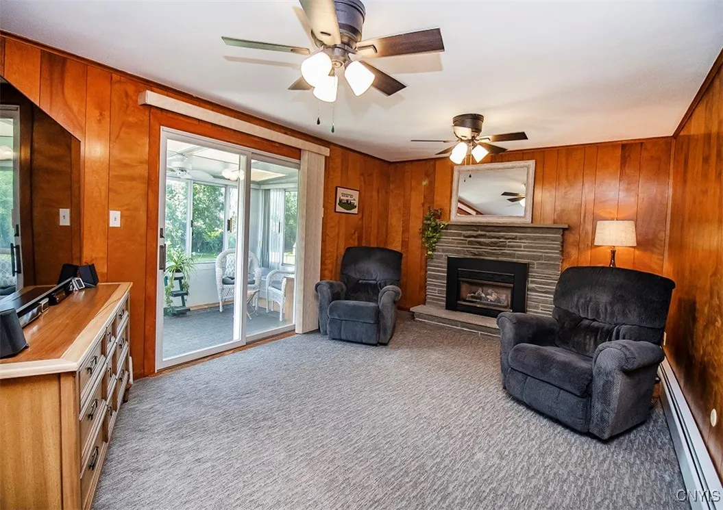 Sliding glass door lead out to the florida room.   Gas fire place is the center of the den!