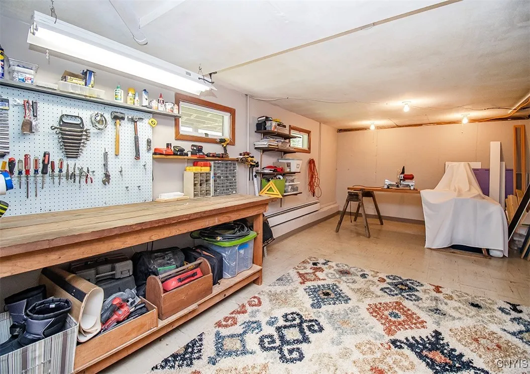 Workshop area and storage room in basement