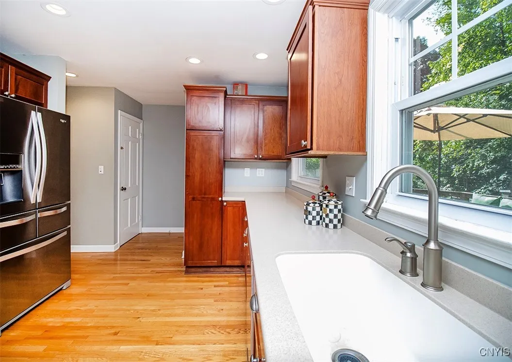 Kitchen overlooks yard and deck...