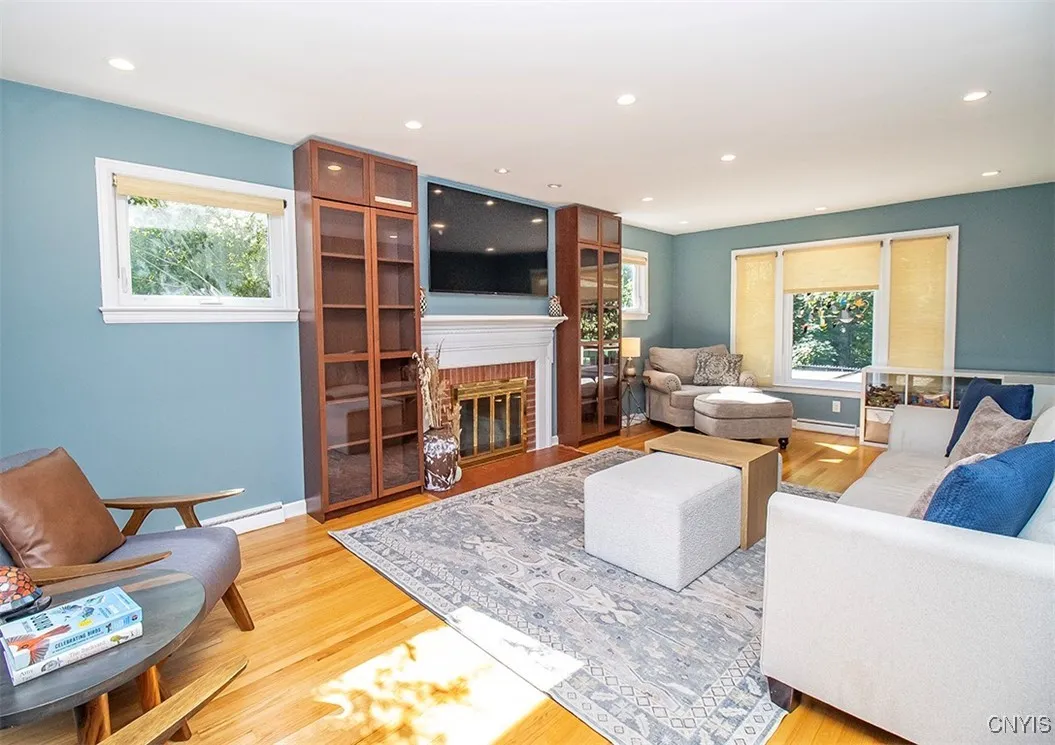 Front to back living room with natural light spilling in from 3 sides...