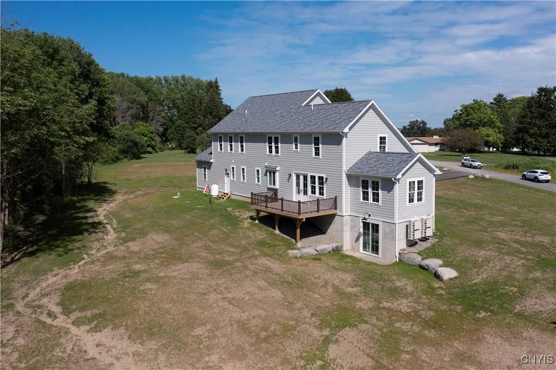 Rear of the house showing deck and walk-out basement door.