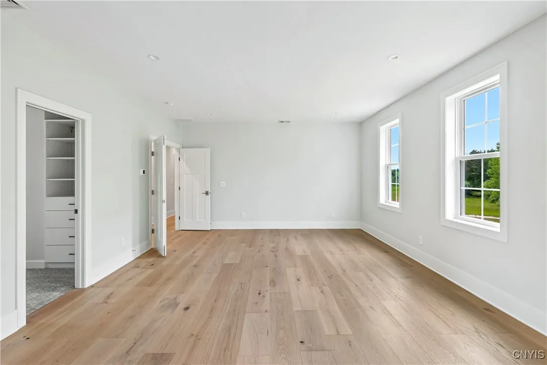 An enormous primary suite with large bath and walk-in closet.