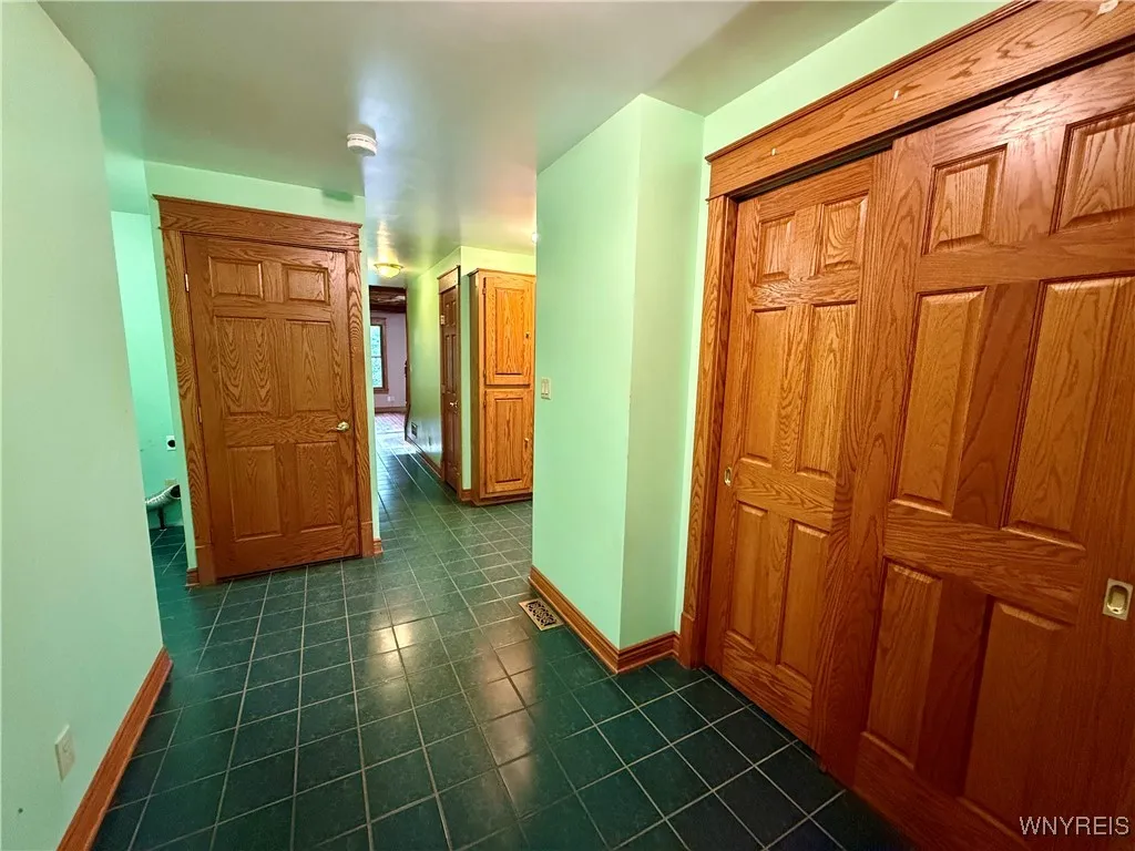 Entry foyer, door to basement.