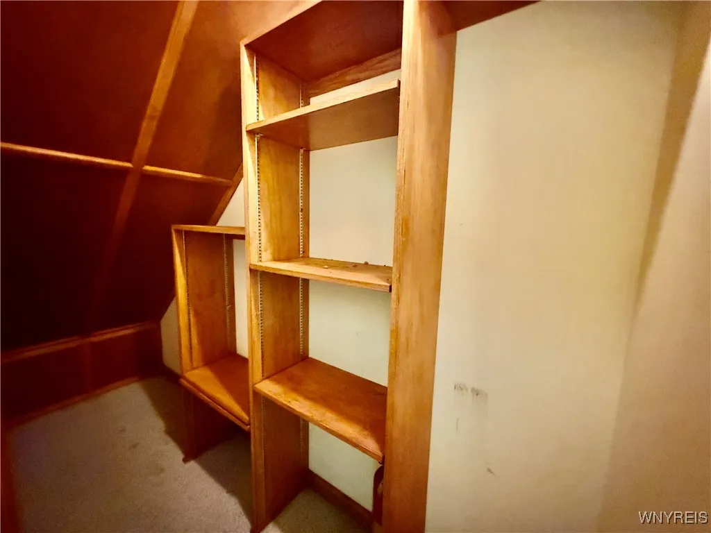 Extra storage under stairs.