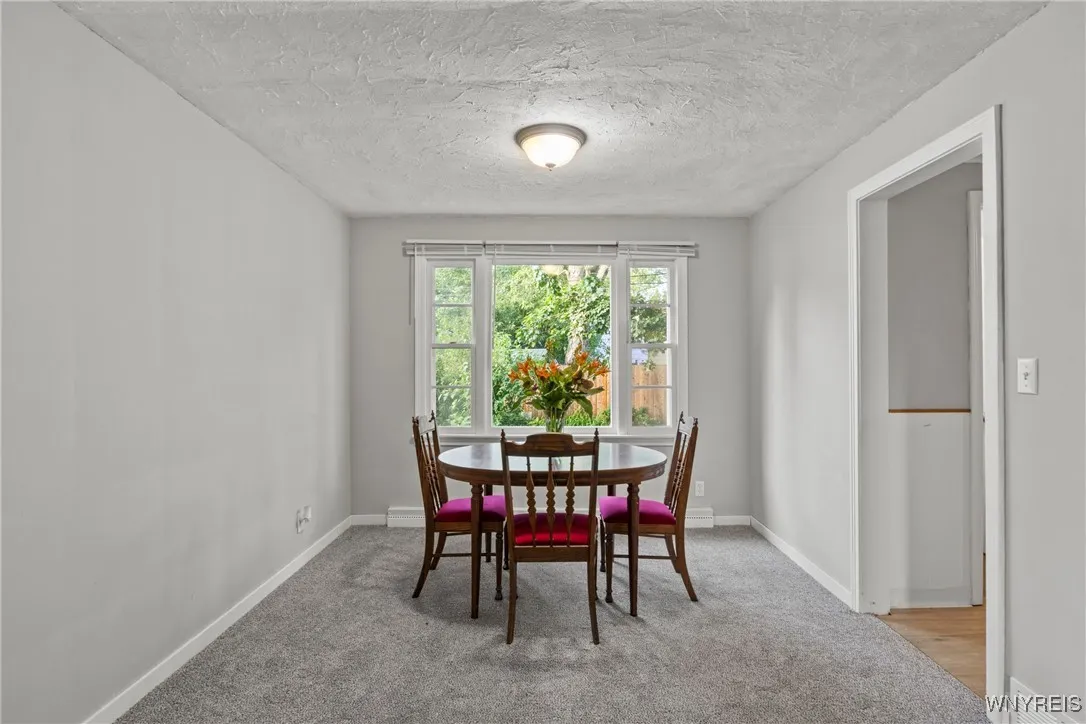 open concept dining area over looking the backyard