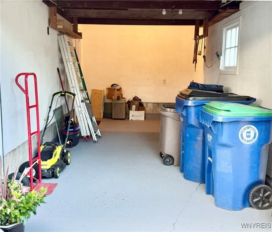 attached garage with plenty of room and a man door to the side