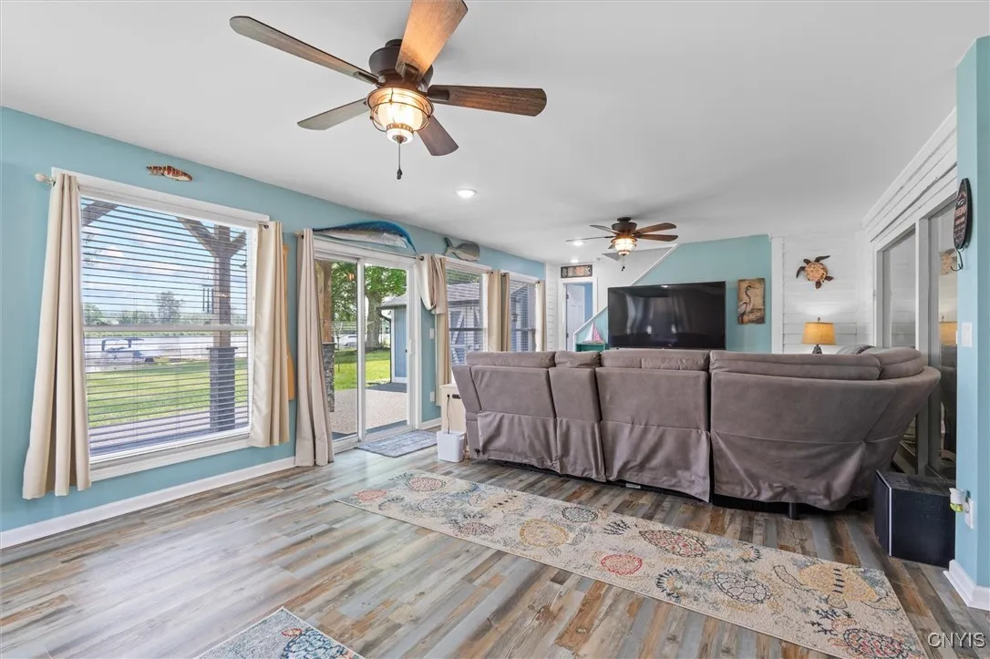 Sunroom, large windows, sliders, pellet stove & tv area
