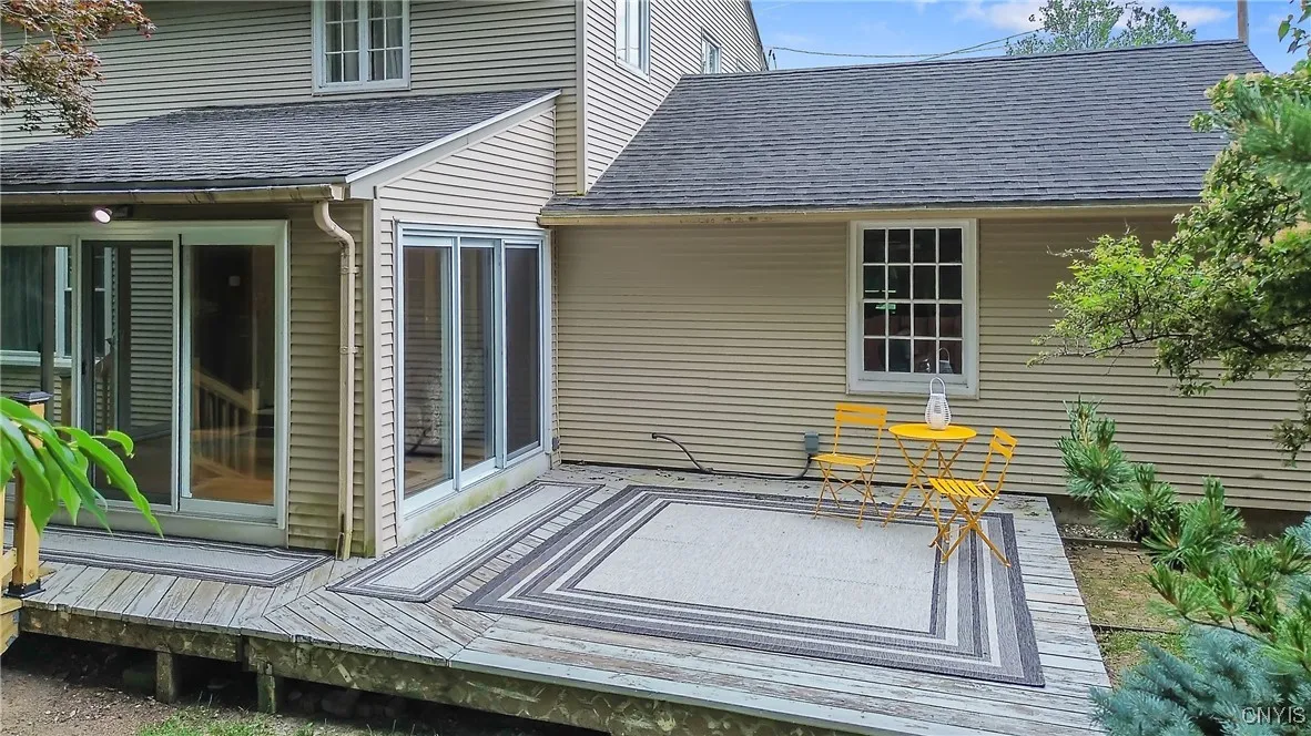A large table and chairs with a grill - and even a smoker - could easily fit on this expansive portion of the deck.